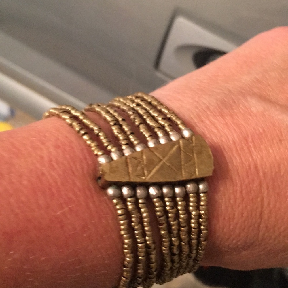 Cooper bracelet with leather strap.